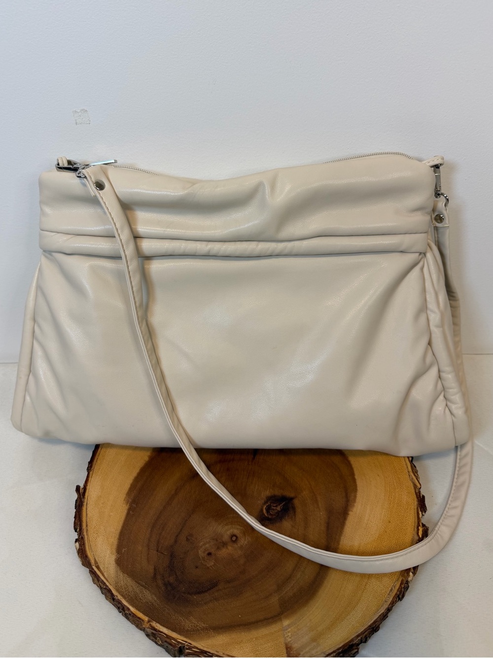 Anthropologie oversized pillow clutch crossbody beige polyurethane exterior